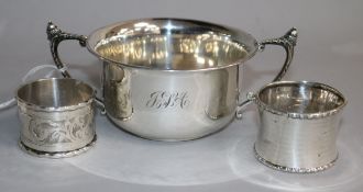 A George V silver porringer and two silver napkin rings.