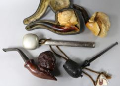 Two Meerschaum pipes and three other pipes