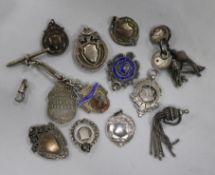 Twelve assorted fobs and medals including silver.