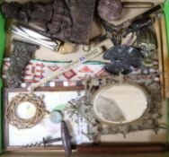 A group of assorted curios including two desk clips, a corkscrew and a bone fan