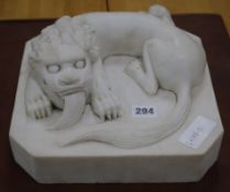 A Chinese carved white marble group of a Shishi and cub