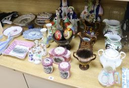A collection of assorted Victorian and later ceramics, including Staffordshire figures and lustre