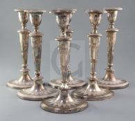 A set of six early 19th century Sheffield plated candlesticks, of oval for, with panelled tapering