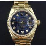A lady's 18ct gold and diamond set Rolex Oyster Perpetual Datejust and box, the blue dial with