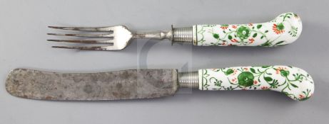 A Danish porcelain handled knife and fork, late 18th century, enamelled in green and red with