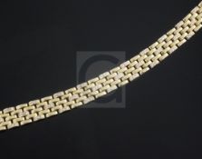 A Cartier 18ct gold and diamond set brick link bracelet, signed and numbered 7866, 18cm.From the