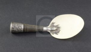 A Chinese silver mounted rhinoceros horn handled serving spoon, late 19th century, with ivory