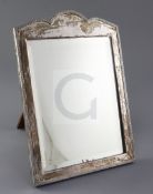 A George V silver mounted rectangular easel mirror by Frederick William Hentsch, with serpentine