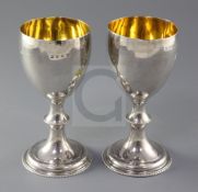 A pair of George III silver wine goblets, with waisted knopped stems, maker's mark rubbed ?A,