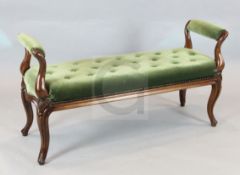 A Victorian carved oak window seat, with green velvet upholstery, on cabriole legs, W.4ft 1in. D.1ft