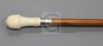 A late Victorian malacca walking stick, with silver banded ivory knop, opening to house a set of