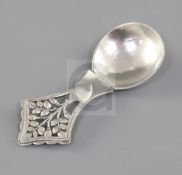 A George V Arts & Crafts silver "Tree of Life" caddy spoon, by Henry George Murphy, hallmarked