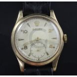 A gentleman's early 1950's 9ct gold mid size Rolex manual wind wrist watch, with Arabic and arrow