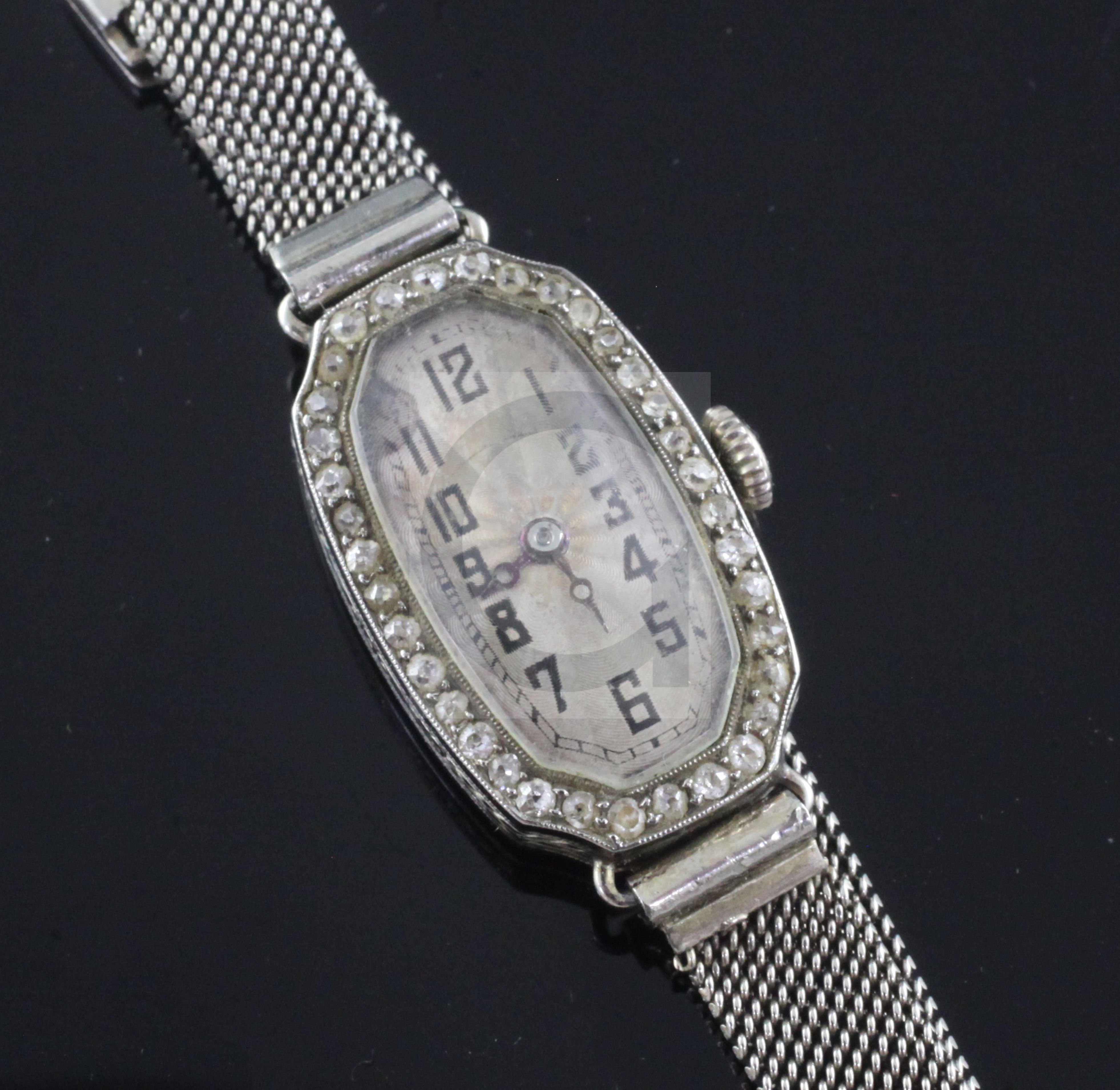 A lady's 1920's 18ct white gold and diamond Rolex manual wind cocktail watch, with octagonal