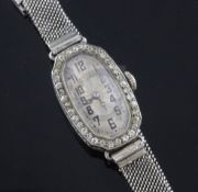 A lady's 1920's 18ct white gold and diamond Rolex manual wind cocktail watch, with octagonal