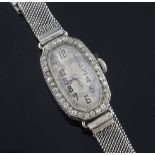 A lady's 1920's 18ct white gold and diamond Rolex manual wind cocktail watch, with octagonal
