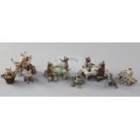 A collection of Austrian cold painted bronze miniatures, comprising dogs drinking at tables (2), a