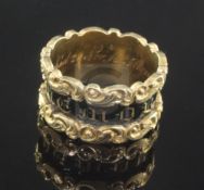 A George IV 18ct gold and black enamel mourning ring, with carved scroll borders, the shank