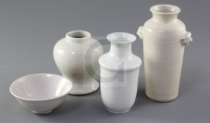 A Chinese Dehua blanc de chine vase, 17th century and two white glazed vases and a bowl, Qing