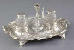 A Victorian silver inkstand by Martin, Hall & Co, with scroll handles, engraved and embossed
