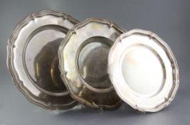 Three graduated continental silver circular dishes, (800, 835 and 935 standard), largest 33.8cm,