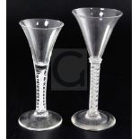 Two opaque twist stem ale glasses, the first c.1770 with a spiral and gauze twist to the stem, 17.