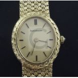 A lady's 18ct gold Jaeger Le-Coultre manual wind dress wrist watch, with oval dial and baton