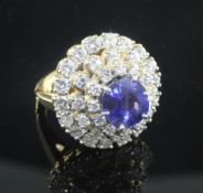 An 18ct gold, platinum and iridium, sapphire and diamond set dress ring, of domed circular form, the