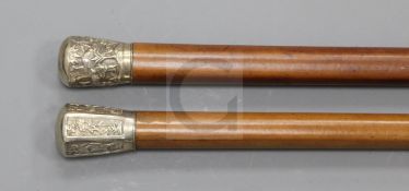 A late 19th / early 20th century Chinese silver knopped malacca cane, decorated with panels of