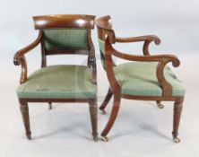 A pair of William IV mahogany carvers, with padded backs and seats, on lotus carved turned and