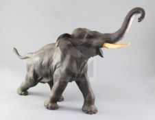 A large Japanese bronze model of an elephant, signed Seiya saku, Meiji period, with ivory inset