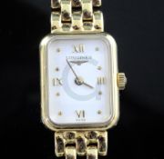 A lady's 18ct gold Longines wristwatch on 18ct gold curblink bracelet, with papers, extra links