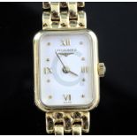 A lady's 18ct gold Longines wristwatch on 18ct gold curblink bracelet, with papers, extra links