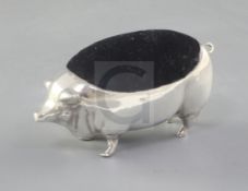 An Edwardian large silver mounted novelty pig pin cushion, by Grey & Co, Birmingham, 1906, length