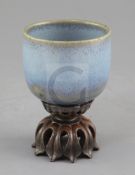 A Chinese Jun-type cup, Qing dynasty, unglazed foot, height 7.5cm, carved rosewood lotus shaped