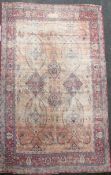 A Kerman carpet, the rose madder field with an all over medallion design, 15ft 10in. x 11ft 8in. (