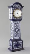 An early 20th century Doulton novelty timepiece, modelled as a longcase with moulded strapwork