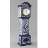 An early 20th century Doulton novelty timepiece, modelled as a longcase with moulded strapwork