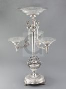 An ornate Victorian silver centrepiece by Horace Woodward & Co, London 1873, the finely decorated