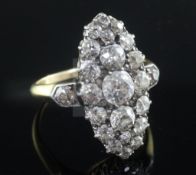 An early 20th century Georgian style gold and old cut diamond set oval dress ring, with diamond