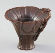 A Chinese rhinoceros horn libation cup, 17th century, the petal lobed cup tapering to an everted