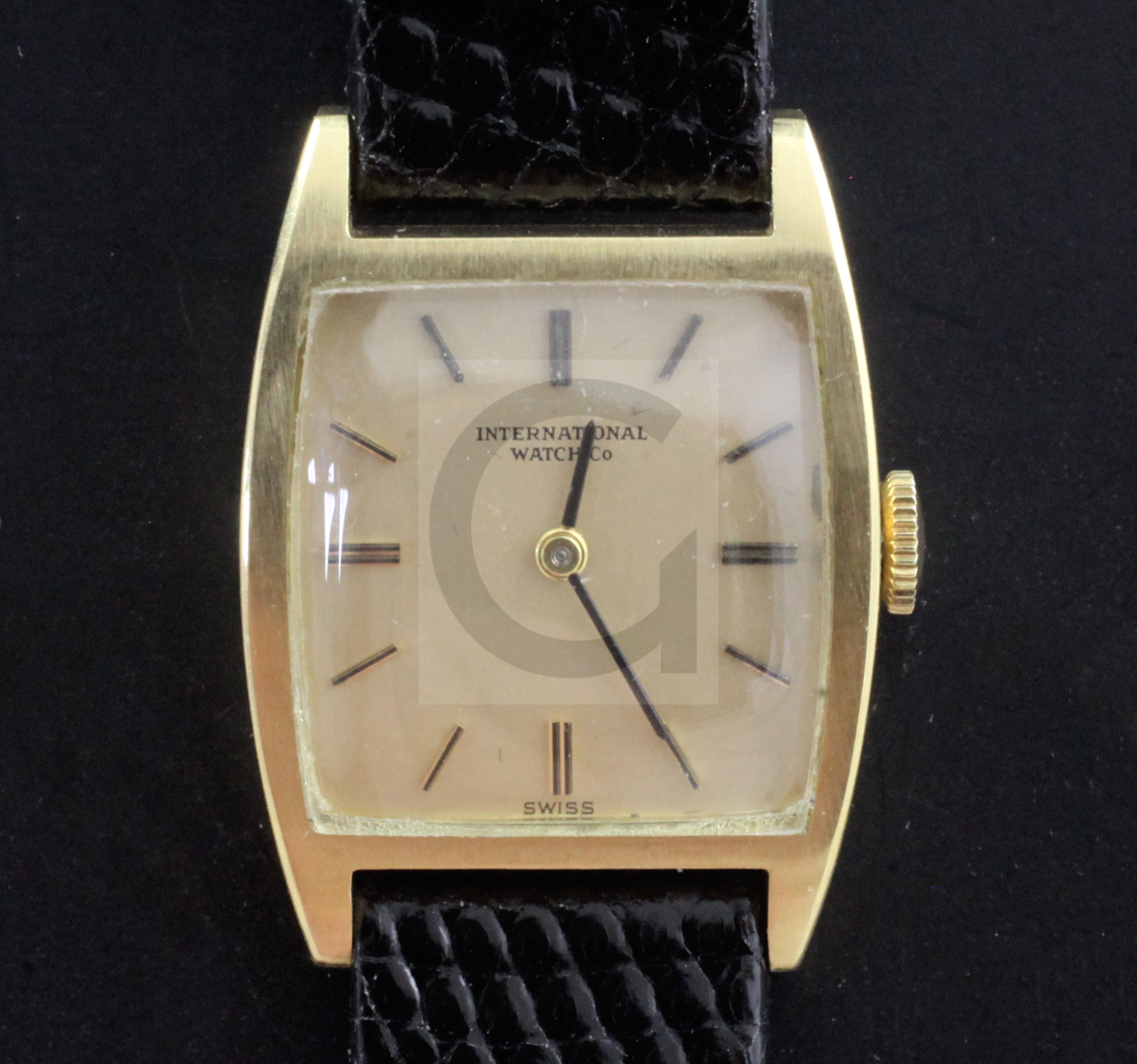 A lady's 18ct gold International Watch Co manual wind wrist watch, with tonneau shaped case and