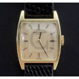 A lady's 18ct gold International Watch Co manual wind wrist watch, with tonneau shaped case and