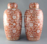 A pair of Chinese rouge-de-fer decorated ovoid vases, 19th century, painted with lotus and other