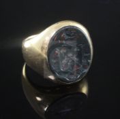 A George V 18ct gold and bloodstone signet ring, carved with the Barlow family crest, Chester, 1923,