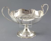 A George V silver two handled pedestal bowl by Atkin Brothers, with wavy border, Sheffield, 1911,