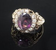 A 19th century gold rhodolite? garnet and rose cut diamond oval dress ring, with carved