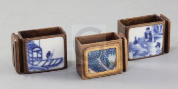 Three Chinese hardwood and porcelain mounted bird feeders, Qing dynasty, two inset with blue and