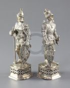 A pair of 1920's German 935 standard silver figures of medieval Knights, with ivory faces, on pieced