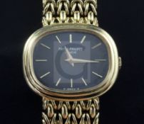 A lady's late 1970's 18ct gold Patek Philippe Calatrava wrist watch, with blue dial, ref. no. 4465/